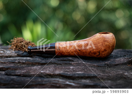 This Tobacco pipe is made from burl wood at white background This Tobacco pipe is made from burl wood at white background 59893903