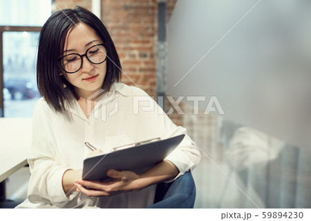 Female Manager holding Clipboard Female Manager holding Clipboard 59894230