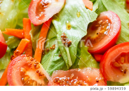salad with red tomato and green lettuce 59894359