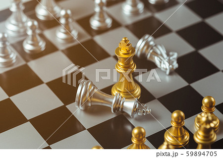 chess game gold king standing and silver chessboard, business strategy concept. 59894705