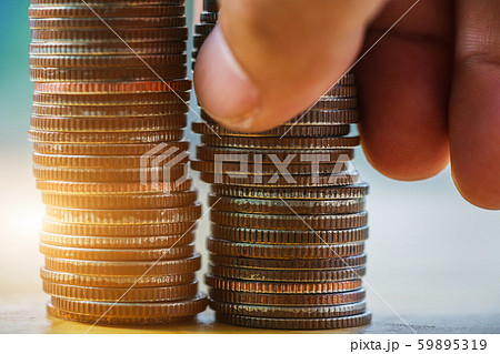 Hand putting coin to stack with saving money concept. business finance growth Hand putting coin to stack with saving money concept. business finance growth 59895319