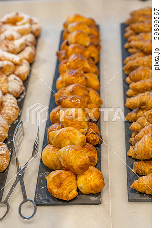 Closeup shot of mini croissant at banquet with beautiful arrangement Closeup shot of mini croissant at banquet with beautiful arrangement 59899567