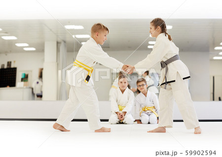 Children practicing karate in gym 59902594