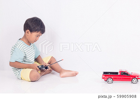cute little boy play semi-automatic toy car on cute little boy play semi-automatic toy car on 59905908