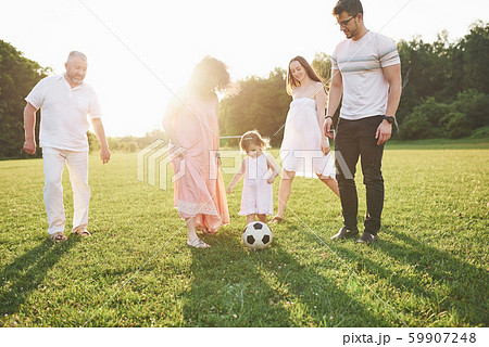Relax with the whole family. Several gender generations came together for a walk in the park 59907248