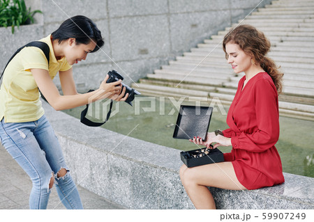 Women making unboxing video 59907249