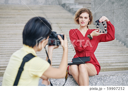 Woman posing with massive necklac 59907252