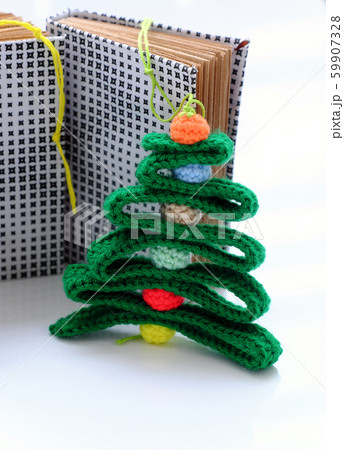 Christmas ribbon tree and colorful baubles with paper notebook on white background 59907328
