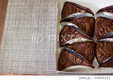 Fresh Chocolate brownie cake portions on wooden background, Top view 59908321