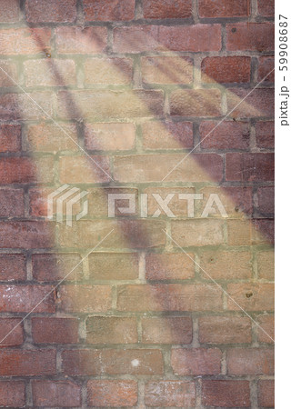 Sunbeams on an old brick wall. Architectural background for your projects Sunbeams on an old brick wall. Architectural background for your projects 59908687