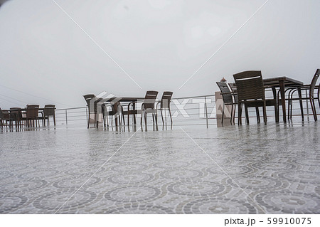 Empty Local Coffee Shop or outdoor restaurant on the mountain with foggy weather. 59910075