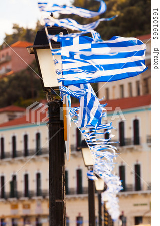 Greek flags waving against city buildings Greek flags waving against city buildings 59910591