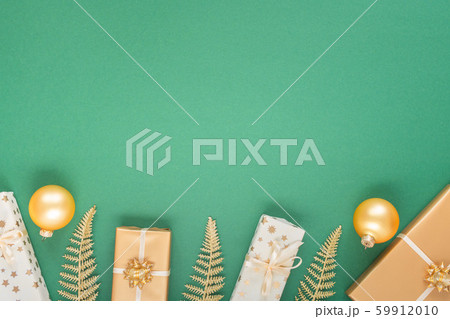 Green christmas background with gift boxes Green christmas background with gift boxes 59912010