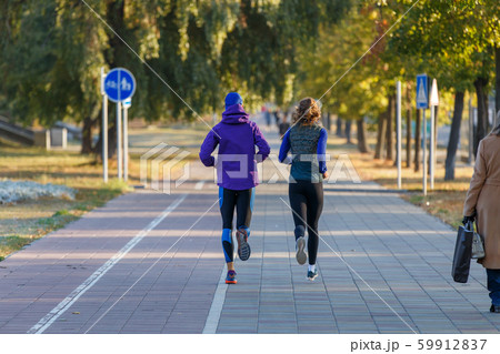 Young couple jogging in city in the morning 59912837