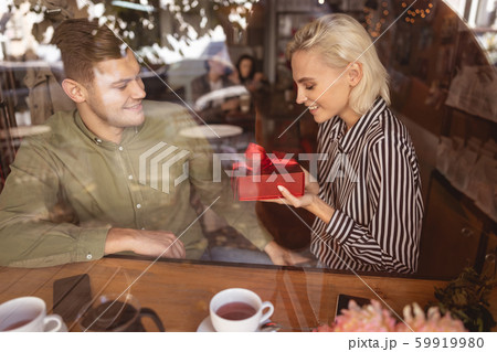 Woman being happy receiving her birthday present 59919980