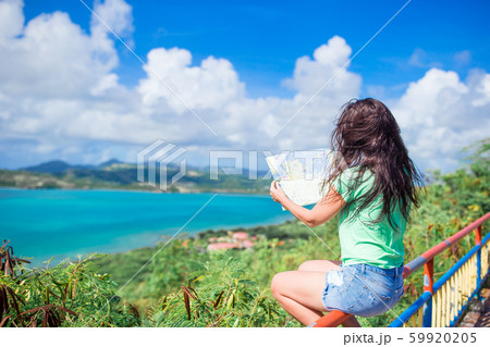 Young tourist woman with view of bay at tropical island in the Caribbean Sea Young tourist woman with view of bay at tropical island in the Caribbean Sea 59920205