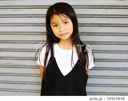 Beautiful Asia kid girl smile portrait and walking traveling on walking street in the city. 59920646