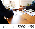 Judge Explaining To Businesswoman At Desk In 59921459
