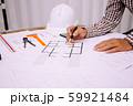 Close-up hand of male Architect drawing blueprint 59921484