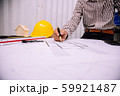 Close-up hand of male Architect drawing blueprint 59921487