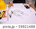 Close-up hand of male Architect drawing blueprint 59921488
