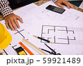Close-up hand of male Architect drawing blueprint 59921489