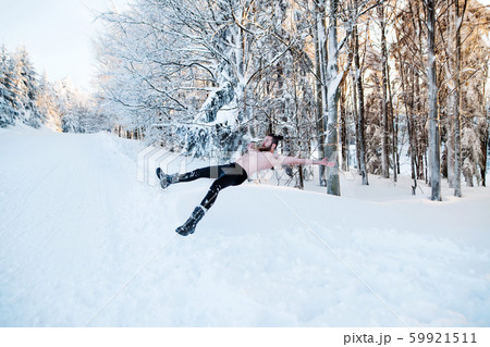 Topless young man outdoors in snow in winter forest, having fun. Topless young man outdoors in snow in winter forest, having fun. 59921511