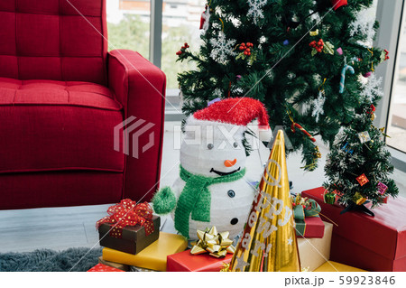 Christmas presents and decorations under conifer tree Christmas presents and decorations under conifer tree 59923846