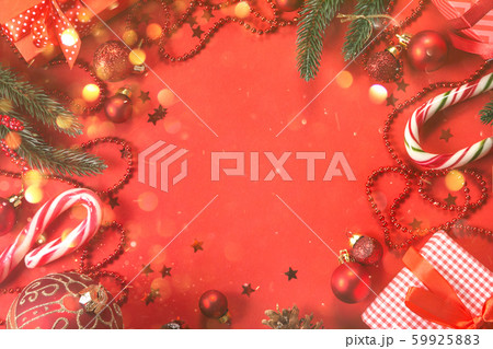 Christmas decorations on red background Christmas decorations on red background 59925883