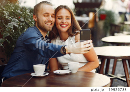 Beautiful couple spend time in a summer city Beautiful couple spend time in a summer city 59926783