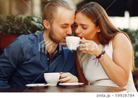 Beautiful couple spend time in a summer city Beautiful couple spend time in a summer city 59926784