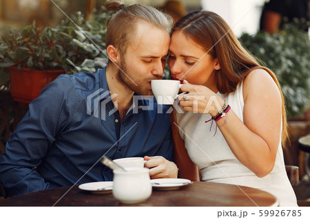 Beautiful couple spend time in a summer city 59926785