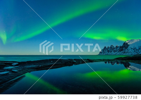 Northern lights, Aurora Borealis, Devil Teeth mountains in the background, Tungeneset, Senja, Norway Northern lights, Aurora Borealis, Devil Teeth mountains in the background, Tungeneset, Senja, Norway 59927738