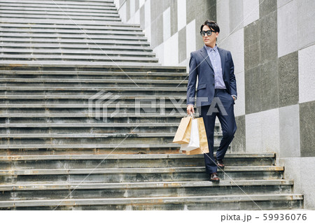 Young man with shoping-bags Young man with shoping-bags 59936076
