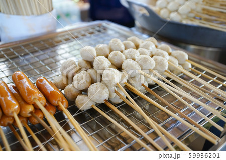 The famous stand up eating meatball in Buri Ram. 59936201
