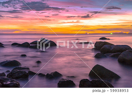 Rocks in the sea at sunset 59938953