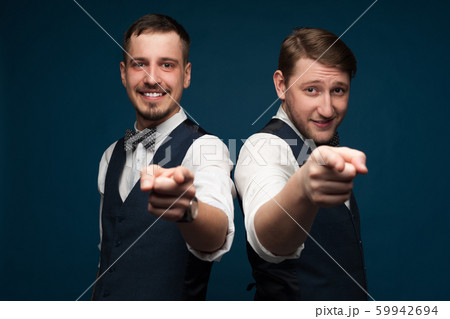 Close-up portrait of two positive young men Close-up portrait of two positive young men 59942694