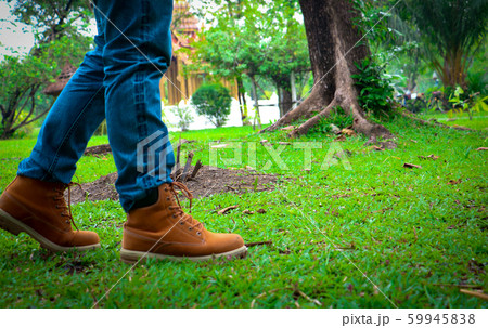 Body part a man walking.He walking on grass background. 59945838