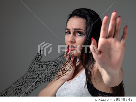Woman in fear of domestic abuse and violence, concept of female rights Woman in fear of domestic abuse and violence, concept of female rights 59949245