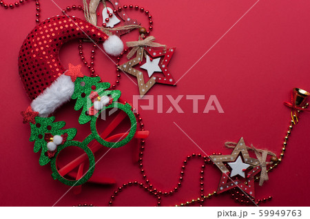 Christmas Headband, Funny Glasses With Green Trees and Wooden Toys on Red Background. 59949763