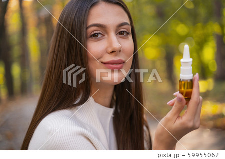 Positive delighted female person posing on camera Positive delighted female person posing on camera 59955062
