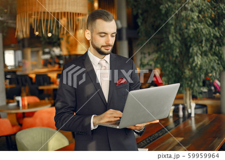 Close up man working with a laptop at the table Close up man working with a laptop at the table 59959964