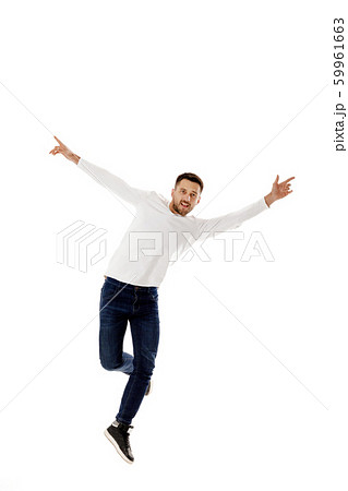 handsome young bearded man jumping 59961663