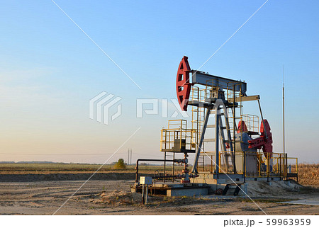 Oil drilling derricks at desert oilfield for fossil fuels output and crude oil production Oil drilling derricks at desert oilfield for fossil fuels output and crude oil production 59963959