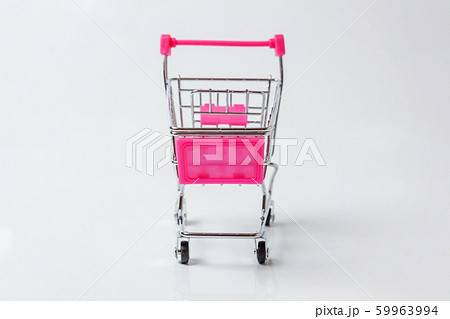 Small supermarket grocery toy push cart on white 59963994