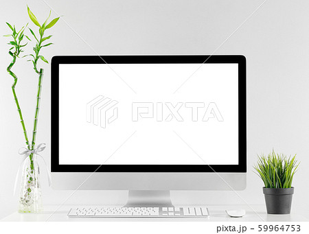Computer all in one in office table with isolated white screen Computer all in one in office table with isolated white screen 59964753
