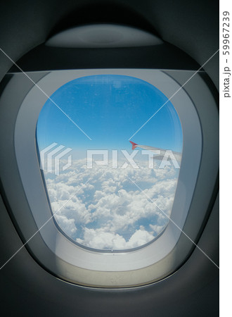 Aiplane windows view on bly sky and clouds from the cabin 59967239