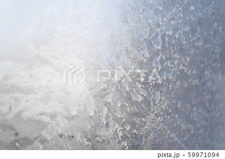 Texture of frost patterns on the window. Abstract winter background Texture of frost patterns on the window. Abstract winter background 59971094