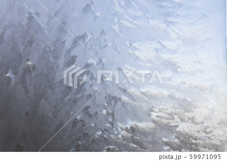 Texture of frost patterns on the window. Abstract winter background Texture of frost patterns on the window. Abstract winter background 59971095