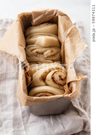 Raw cinnamon bread in a baking dish. Copy space. Raw cinnamon bread in a baking dish. Copy space. 59974311